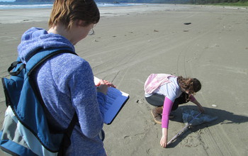 COASST interns size up a plastic bag.